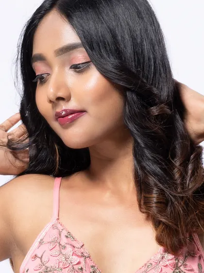 A close-up beauty shot, with a soft and gentle expression.