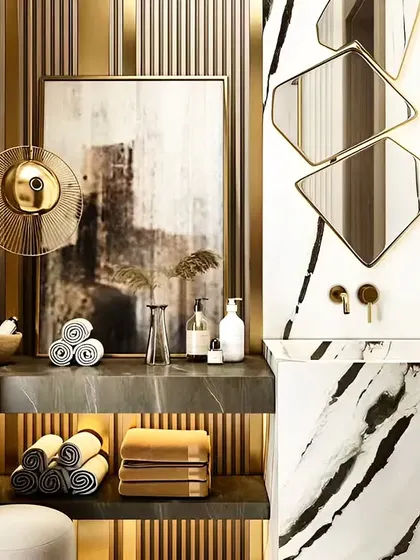 This bathroom corner exudes luxury with its marble-patterned sink and gold accents. The geometric mirrors and custom shelving create a highly stylized and glamorous space.