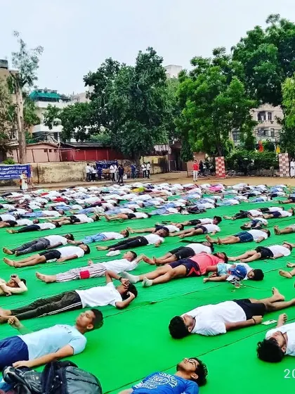 Players practicing Savasana (Corpse Pose) during our Yoga Day event. Relaxation and recovery are a crucial part of our training regimen.