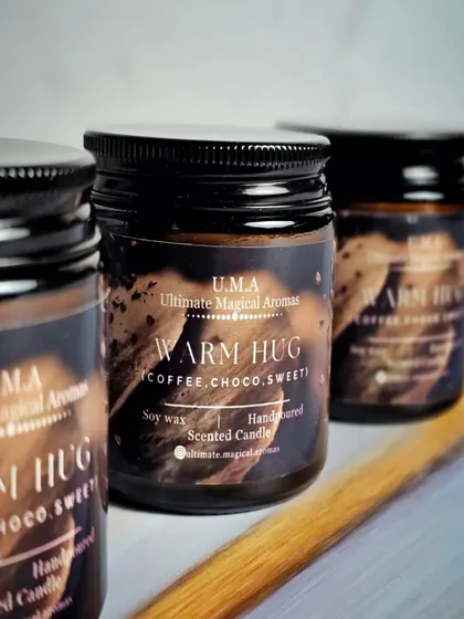 My 'Warm Hug' Amber Jar Candles, which smell of rich coffee, chocolate, and sweet notes. It's the perfect scent for a cozy morning or a relaxing evening.