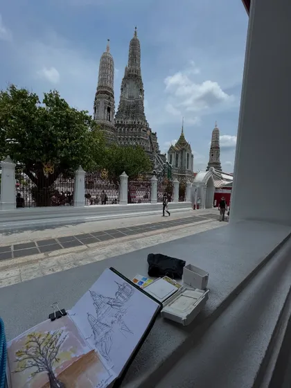 Sketching the magnificent Wat Arun temple in Thailand. The thrill of painting live on location is about capturing the essence of a place before the moment passes.
