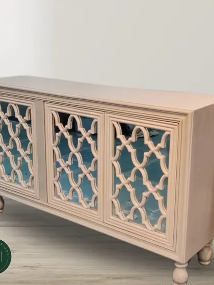 A studio shot of the lattice-door sideboard, highlighting its intricate craftsmanship and sophisticated design. This piece combines traditional motifs with a clean, modern finish.
