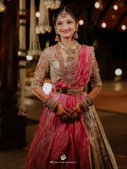 A full view of this stunning half saree. The rich pink and gold colors and the intricate embroidery make it a true work of art.