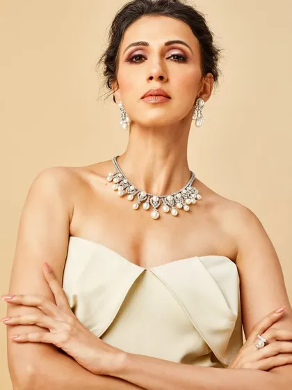 The elegance of pristine white, captured in every sparkle. This diamond and pearl necklace set offers a look of classic sophistication and timeless grace.