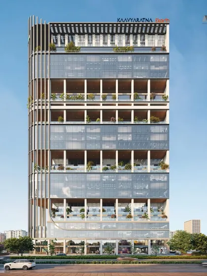 The full facade of the 29-story Narmada commercial building. The design strategically alternates between glass-enclosed floors and open, landscaped terraces, creating a visually dynamic and climate-responsive structure.
