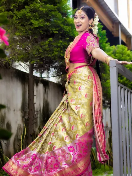 The joy of a bride on her special day. This South Indian bridal makeup is designed to look fresh and radiant, even in natural outdoor lighting.