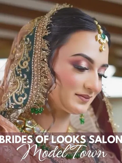 A beautiful portrait of one of our brides, showcasing a soft and romantic makeup look. The pink-toned eyeshadow and glowing skin pair perfectly with her pastel and green ensemble for a fresh, elegant appearance.