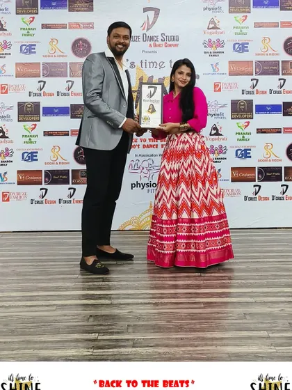 Presenting an award to a winner of the "Back to the Beats" showcase.