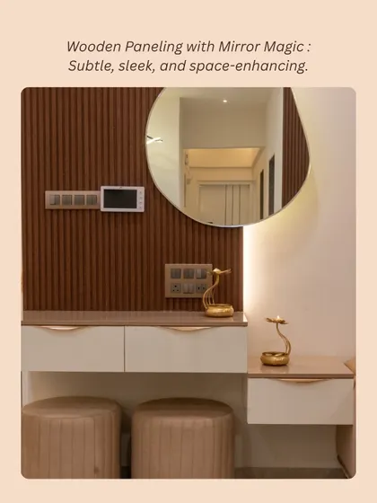 This foyer features wooden paneling and a large, organically shaped mirror, creating a sleek and space-enhancing entrance.