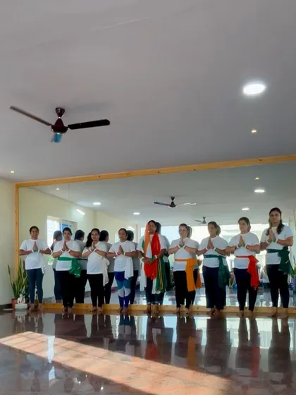 Our community standing together in honor of Independence Day. We bring the principles of unity and respect from our mats into our celebrations.