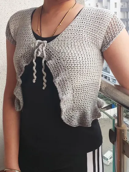 The Orchid Top is a perfect lightweight layer for adding a touch of handmade charm to your look.