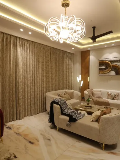 This view shows the complete seating arrangement in the Harmony Home living room, where different furniture styles and textures are layered to create a rich, inviting atmosphere.