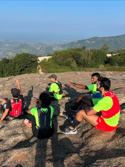 Taking a break with the team at the top of Nandi Hills, enjoying the view and the company.