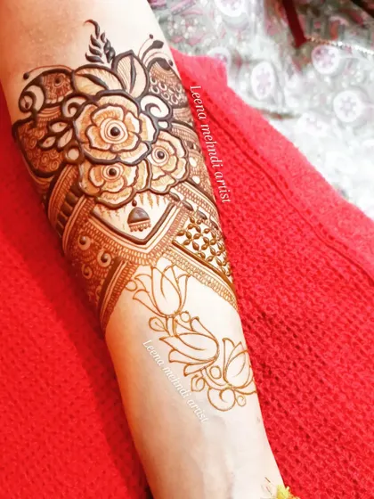 A completed heavy arm piece, perfect for a bride or close family member. The design combines bold roses with delicate lotus patterns, creating a beautiful contrast.