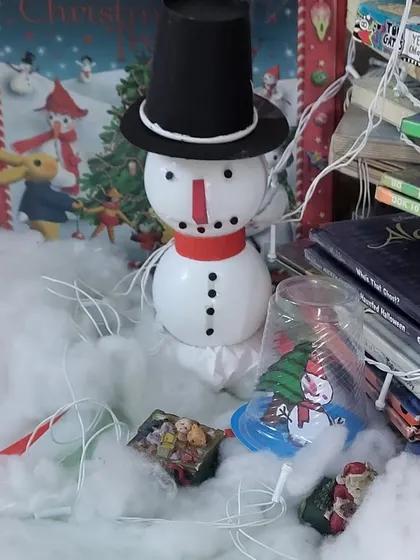 A close-up of our Christmas decorations, including a cute snowman made from simple materials. We love getting creative and making the library feel festive for the holidays.