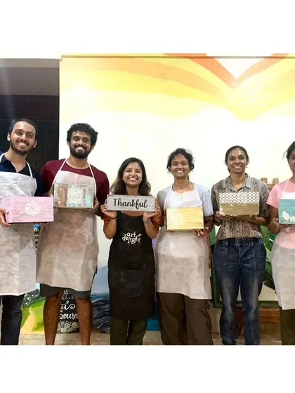 The whole group from our wood distressing workshop, proudly holding their unique creations. So much creativity in one room!