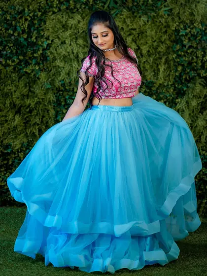 A full-length shot showing the twirl of the lehenga. The makeup is designed to look stunning both up close and from a distance, perfect for dynamic photoshoots.