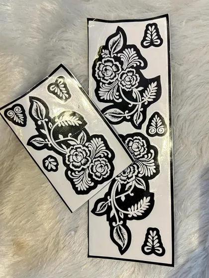 A beautiful floral vine stencil set. These can be used along the side of the hand, down the arm, or even on the feet. The set includes separate leaf elements to customize your design.
