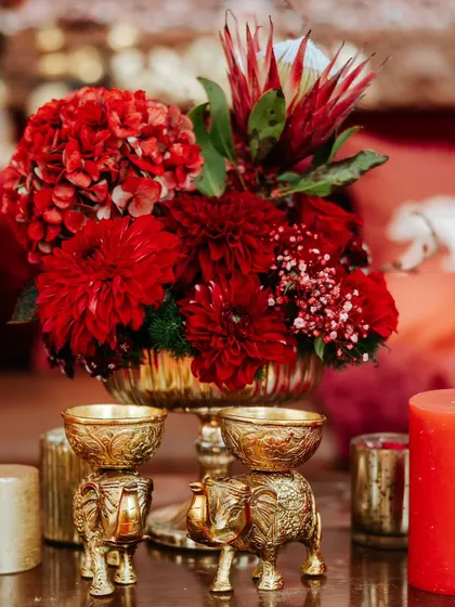 Intricate brass elephant-shaped bowls used as part of the decor. These small, traditional elements add a layer of cultural richness and visual interest.