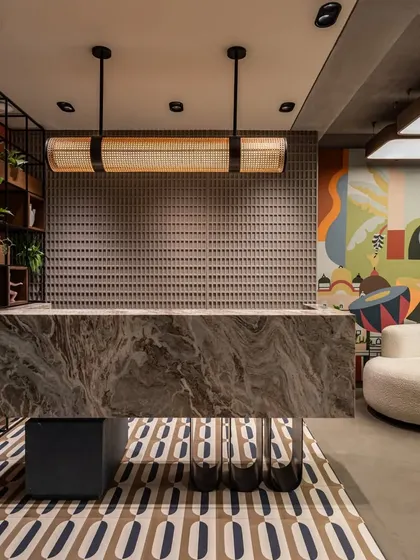 The mural as a backdrop for the office's reception area, creating a powerful first impression for clients. The artwork holds the pulse of a thousand stories of cities that never sleep.