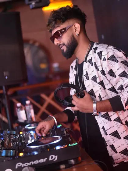 Confidence comes from preparation. Here I am, focused on the mix, ensuring every transition is perfect.