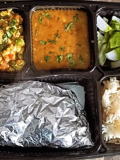 A comforting thali with dal tadka and paneer bhurji. The fresh salad with mooli (radish) adds a nice crunch.