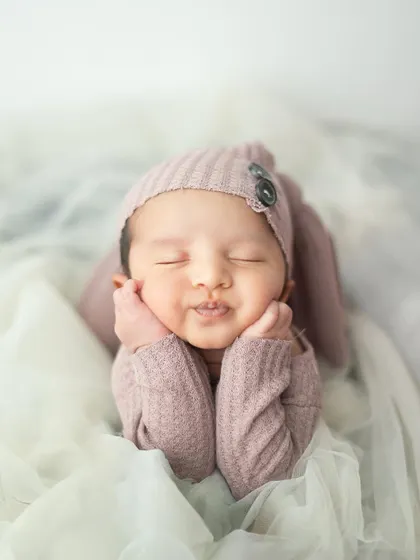 Such a perfect pout. This close up shot captures the delicate features and soft skin of a newborn, creating a portrait you will cherish.