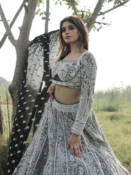 A full shot of the black and white lehenga, highlighting the stunning contrast and the beautiful craftsmanship.