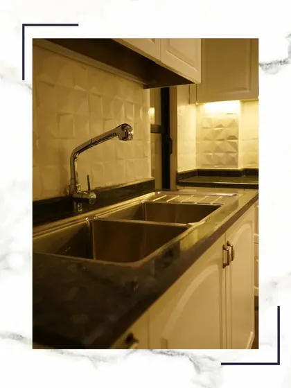 Every meal deserves a kitchen that feels like home. The double stainless steel sink, granite countertop, and textured tile backsplash combine for a premium and practical cooking experience.