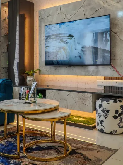 The stunning TV unit in a client's home, featuring a marble-finish backdrop and integrated lighting, which was a highlight of their positive review.