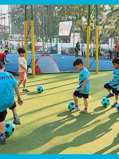 A typical day at our kids football camp involves lots of movement. Here, our students practice keeping the ball close as they move across the field, learning coordination and focus in a playful group setting.