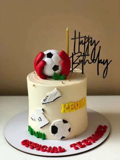 An "Official Teenager" football cake, celebrating a 13th birthday with a soccer theme.
