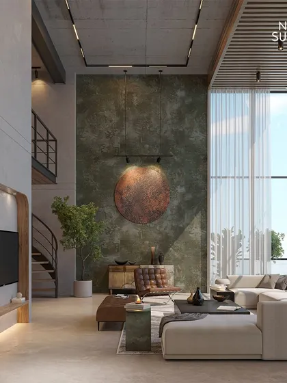 Inspired by Le Corbusier, this living room at our Gurgaon Hills project features a monumental double-height textured wall. The design balances raw, unpolished materials with minimal luxury for a powerful aesthetic.