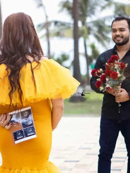 A creative and sweet pregnancy announcement idea. She holds the sonogram pictures behind her back as he waits with a bouquet of roses.