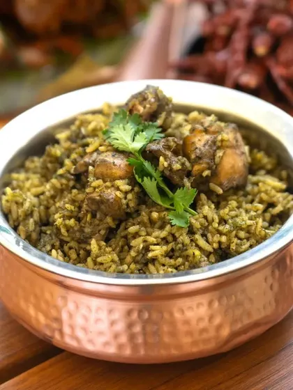 This is a green masala chicken palav, a flavourful rice dish where the chicken and rice are cooked together in a fresh, herb-based masala.