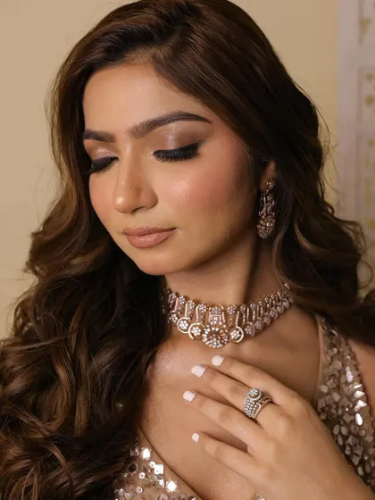 A detailed shot of the eye makeup, showcasing the blend of dark and light shades to create a dramatic effect.