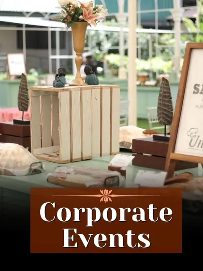 A stylish salad and appetizer station set up for a corporate event. The rustic-chic decor with wooden crates and chalkboards adds a touch of elegance to the occasion.