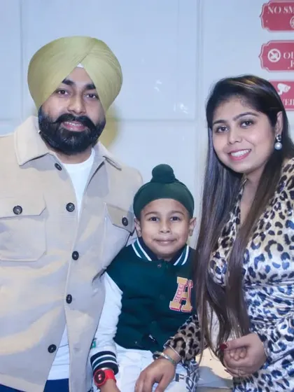 A family portrait of a couple and their young son. We specialize in family photography for events in the Noida and Greater Noida area.