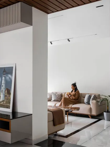 **Achrome, Ahmedabad:** In this renovation, we played with levels and sightlines to create distinct zones. A fresh color scheme of warm whites and cool blacks acts as a canvas, allowing key architectural elements and furniture to stand out.