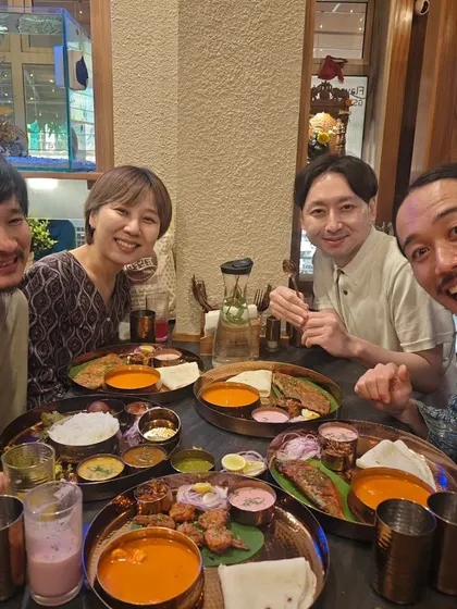 Enjoying a meal out with my friends from Japan. Exploring Mumbai's food scene together, from street food to iconic cafes, is always a highlight of their visit.