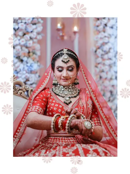 A candid moment of the bride adjusting her bangles. These small moments are where the beauty of the complete look truly shines.