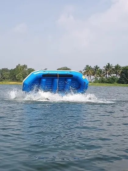 A raft is intentionally flipped during a training exercise at our Ambigarahalli center. This drill prepares participants for real-world scenarios.