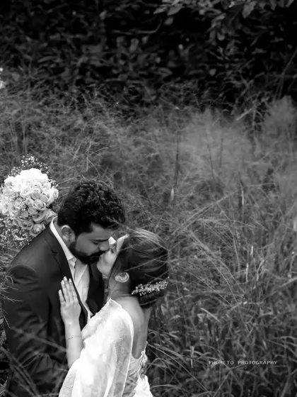 The same intimate moment in timeless black and white, emphasizing the emotion and connection between the couple.