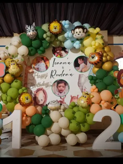 Let's go on a safari! This jungle-themed birthday is one of our favorites, featuring a full arch of green and earthy-toned balloons, adorable animal cutouts, and custom photo placements for the little adventurers.