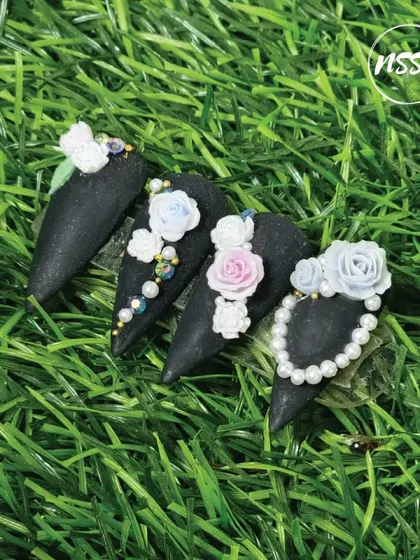 A sophisticated take on 3D art. This set features a matte black base with sculpted flowers and pearl accents, creating a beautiful contrast between the dark background and the delicate details.