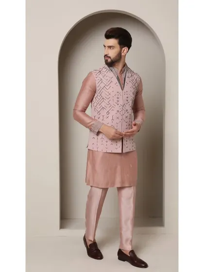 A side profile of the 'Mystic Rose' bandi set. This angle highlights the V-cut of the jacket and the intricate geometric embroidery that covers its surface.