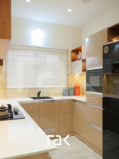 Another view of this compact and efficient kitchen, showing the seamless integration of the refrigerator and oven. The design balances aesthetics and practicality perfectly.