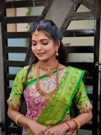 My signature fluffy pleating on a beautiful silk saree. This technique creates a full, fan-like effect that is a hallmark of South Indian draping.
