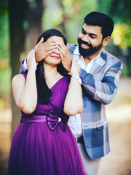 A sweet and playful moment from a pre-wedding shoot. The purple tulle gown is lightweight and easy to move in, making it great for capturing candid interactions.