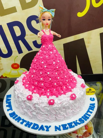 A 3kg Barbie doll cake with an intricate pink and white piped dress.